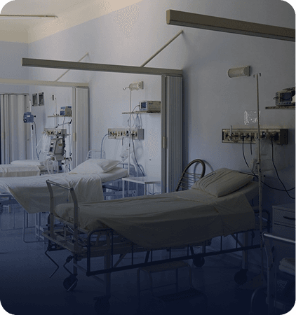Hospital bed and medical equipment set up in a room