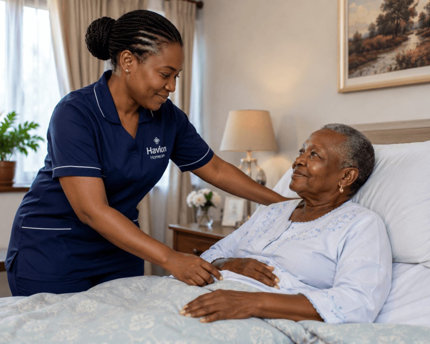 Nurse attending to an older woman resting in bed